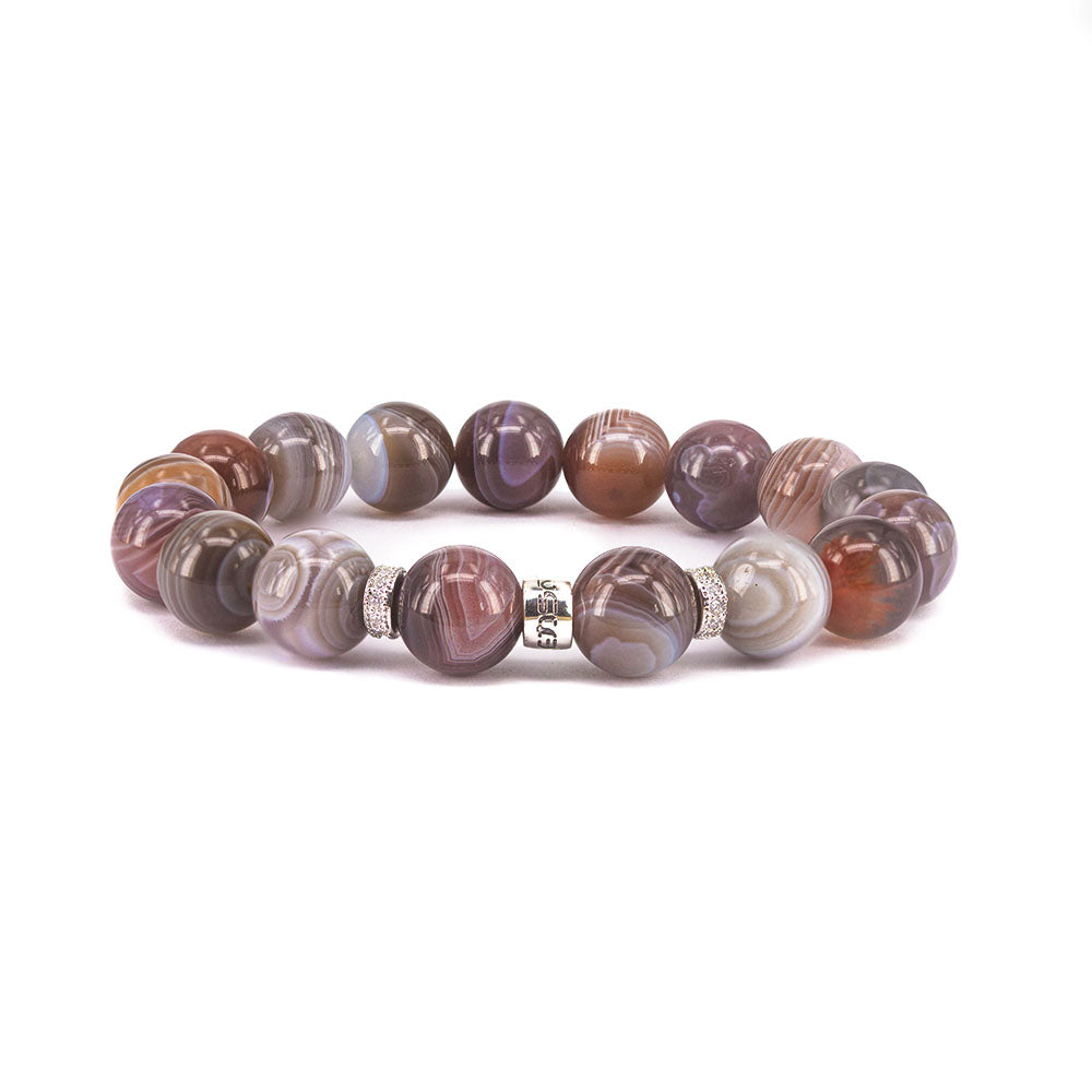 Victoriaenso's Botswana Agate is a luxurious and rare stone with distinctive white bands. Dating back nearly 200 million years, these agates offer balance and good fortune to its wearer.
