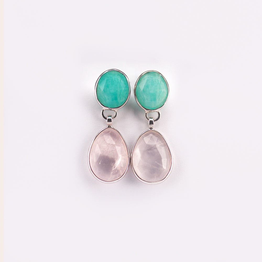 Adorn yourself in timeless beauty with Victoriaenso's Sterling Silver Amazonite & Rose Quartz Earrings. Crafted with 925 sterling silver, these hypoallergenic earrings feature gemstones from Madagascar, believed to bring luck, success, and love. Enjoy the protective energy of amazonite and the unconditional love of rose quartz with this exquisite accessory